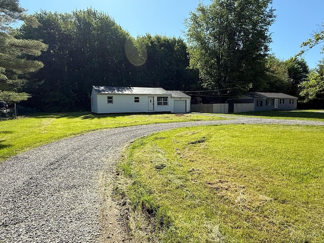 5776 State Route 132, Stonelick Twp, OH 45103 - view of front of house with gravel driveway, an attached garage, and a front lawn