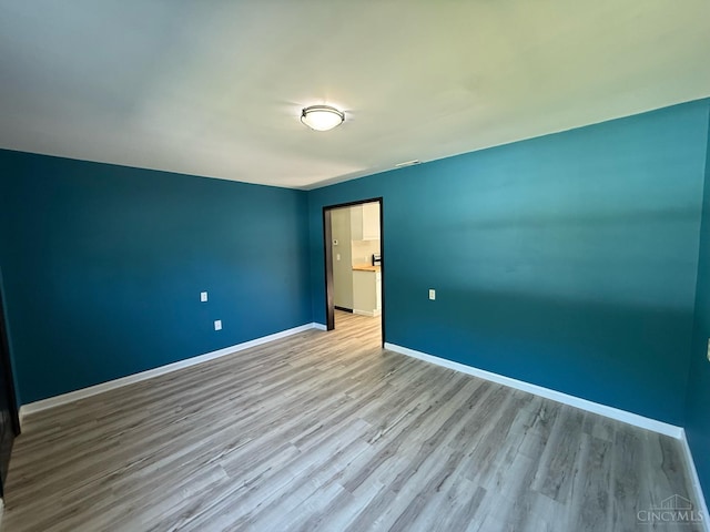 5776 State Route 132, Stonelick Twp, OH 45103 - unfurnished room with wood finished floors and baseboards