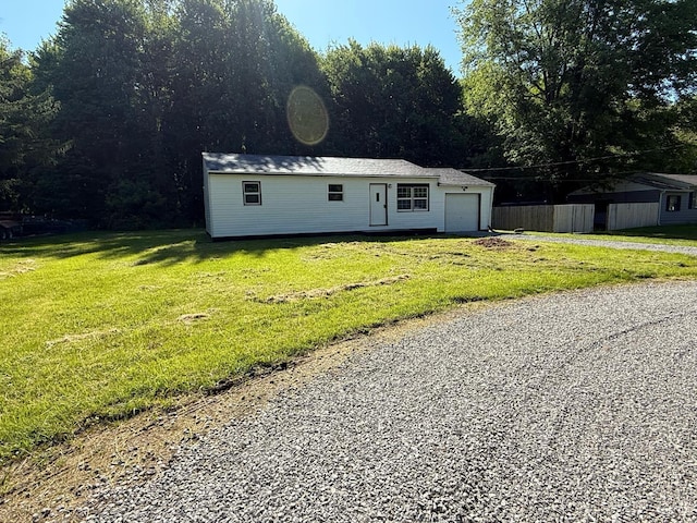 5776 State Route 132, Stonelick Twp, OH 45103 - view of front of house with driveway, a front yard, an outdoor structure, and a garage