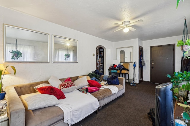 3366 Wunder Ave, Cincinnati, OH 45211 - living room with arched walkways, ceiling fan, and carpet floors