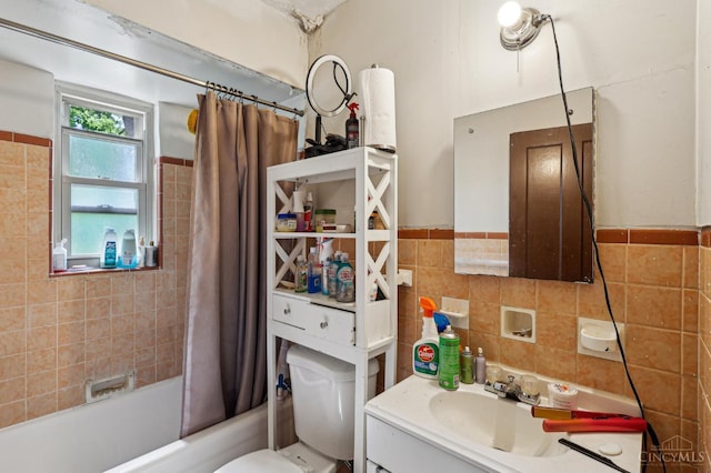 3366 Wunder Ave, Cincinnati, OH 45211 - full bathroom featuring shower / bath combination with curtain, tile walls, vanity, and toilet