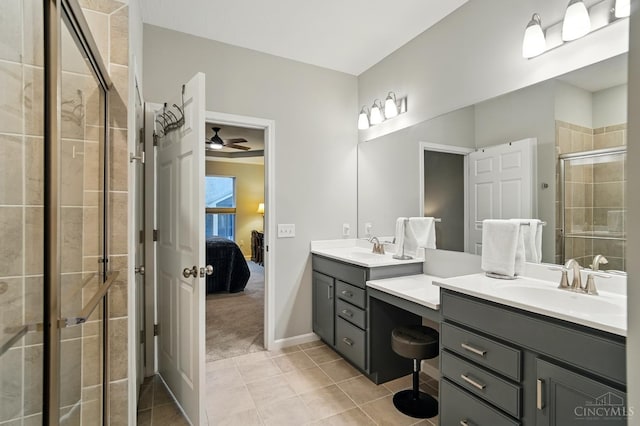 5014 S Castle Ct, Liberty Twp, OH 45011 - ensuite bathroom featuring double vanity, a stall shower, tile patterned flooring, a ceiling fan, and baseboards