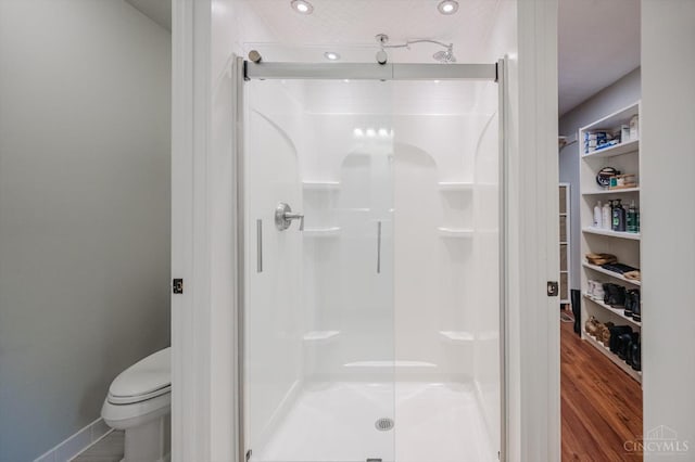 1171 Craig Ct, Hamilton Twp, OH 45039 - full bathroom with a stall shower, toilet, wood finished floors, recessed lighting, and baseboards