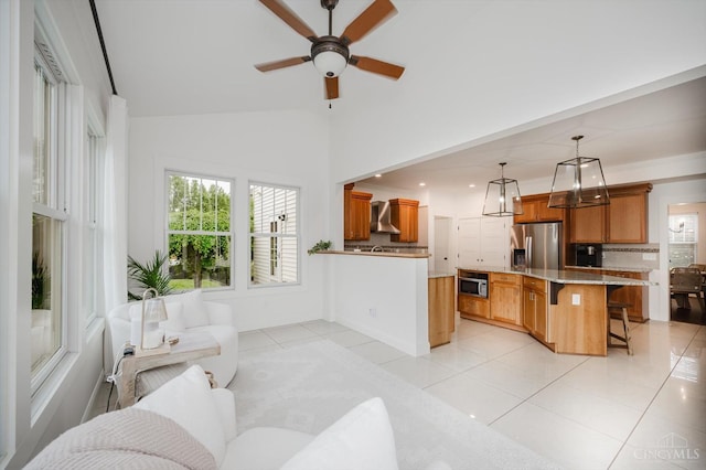 1171 Craig Ct, Hamilton Twp, OH 45039 - living room featuring light tile patterned floors, plenty of natural light, a ceiling fan, and high vaulted ceiling