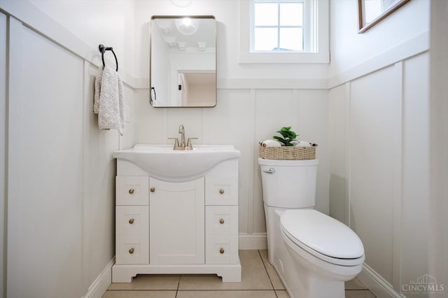 1171 Craig Ct, Hamilton Twp, OH 45039 - bathroom with toilet, vanity, tile patterned flooring, and a decorative wall