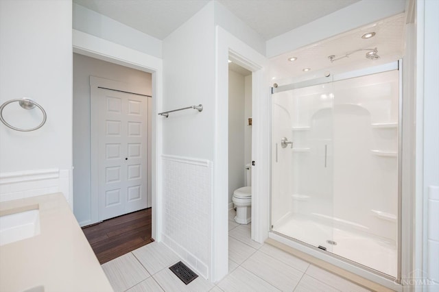 1171 Craig Ct, Hamilton Twp, OH 45039 - bathroom featuring a shower stall, toilet, tile patterned floors, and vanity