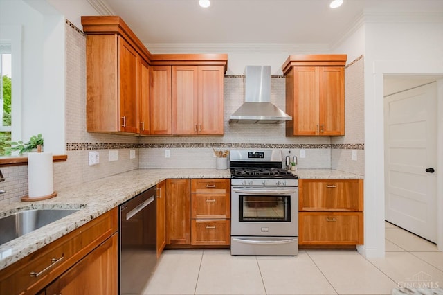 1171 Craig Ct, Hamilton Twp, OH 45039 - kitchen featuring wall chimney exhaust hood, appliances with stainless steel finishes, light tile patterned floors, crown molding, and light stone counters