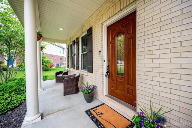 1171 Craig Ct, Hamilton Twp, OH 45039 - property entrance with a porch and brick siding