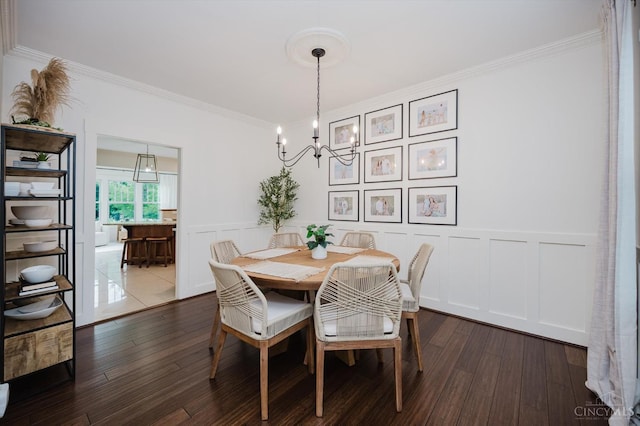 1171 Craig Ct, Hamilton Twp, OH 45039 - dining room with a decorative wall, ornamental molding, a chandelier, dark wood-type flooring, and wainscoting