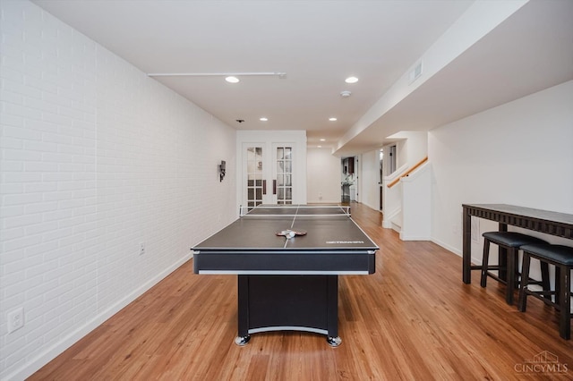 1171 Craig Ct, Hamilton Twp, OH 45039 - playroom featuring brick wall, light wood-style floors, baseboards, and recessed lighting