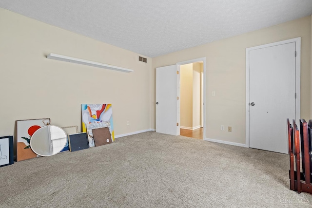 2020 Woodcreek Dr, Fairfield, OH 45014 - carpeted bedroom with baseboards and a textured ceiling
