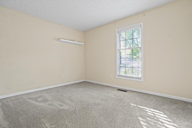 2020 Woodcreek Dr, Fairfield, OH 45014 - carpeted spare room featuring a textured ceiling and baseboards