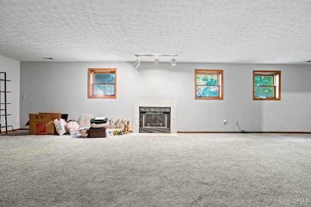 2020 Woodcreek Dr, Fairfield, OH 45014 - carpeted living room with a fireplace, baseboards, and a textured ceiling