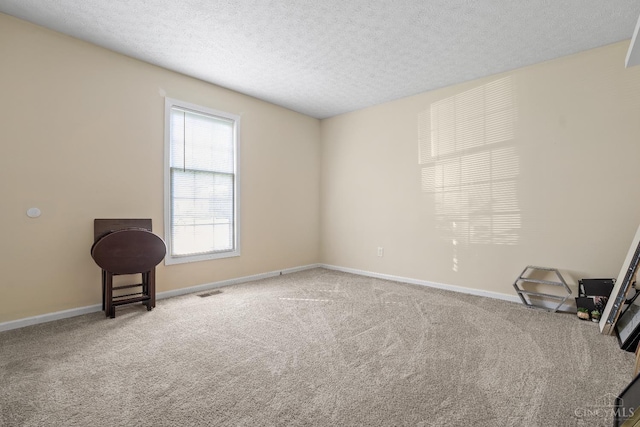 2020 Woodcreek Dr, Fairfield, OH 45014 - unfurnished room with carpet flooring, a textured ceiling, and baseboards