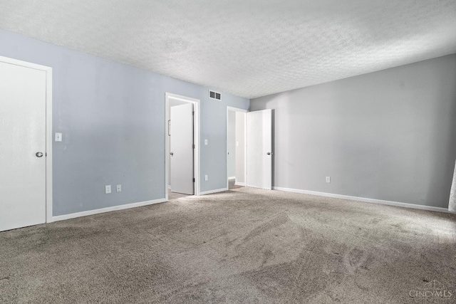 2020 Woodcreek Dr, Fairfield, OH 45014 - unfurnished bedroom with carpet, a textured ceiling, and baseboards
