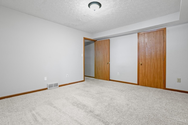 2020 Woodcreek Dr, Fairfield, OH 45014 - unfurnished bedroom featuring a textured ceiling, a closet, carpet floors, and baseboards