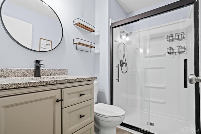 2020 Woodcreek Dr, Fairfield, OH 45014 - bathroom featuring vanity, a stall shower, and toilet
