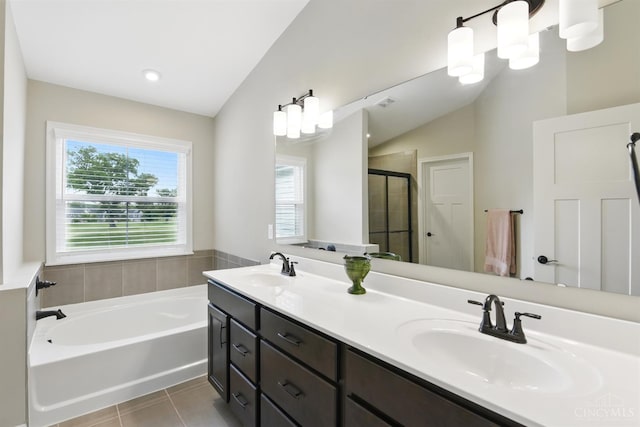 1387 Lake Run Dr, Turtle Creek Twp, OH 45036 - bathroom with a shower stall, vaulted ceiling, tile patterned flooring, a garden tub, and double vanity