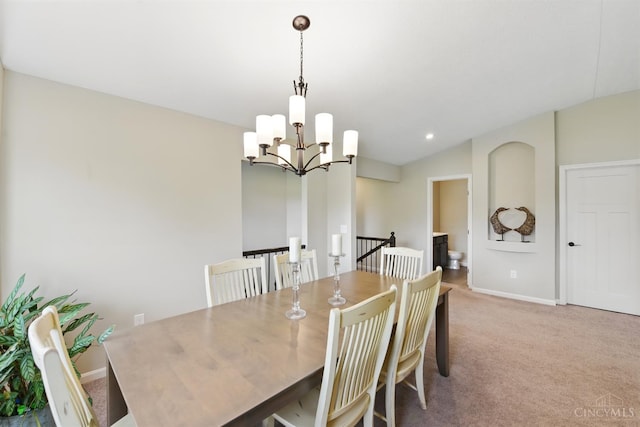 1387 Lake Run Dr, Turtle Creek Twp, OH 45036 - dining area with a chandelier, light colored carpet, baseboards, and vaulted ceiling