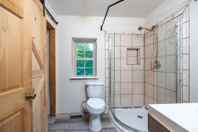 1182 Hook Morgan Rd, Concord Twp, OH 45679 - full bath featuring toilet, a stall shower, wood finished floors, and vanity