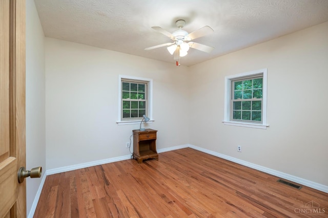 1182 Hook Morgan Rd, Concord Twp, OH 45679 - unfurnished room featuring ceiling fan, light wood-style floors, and baseboards