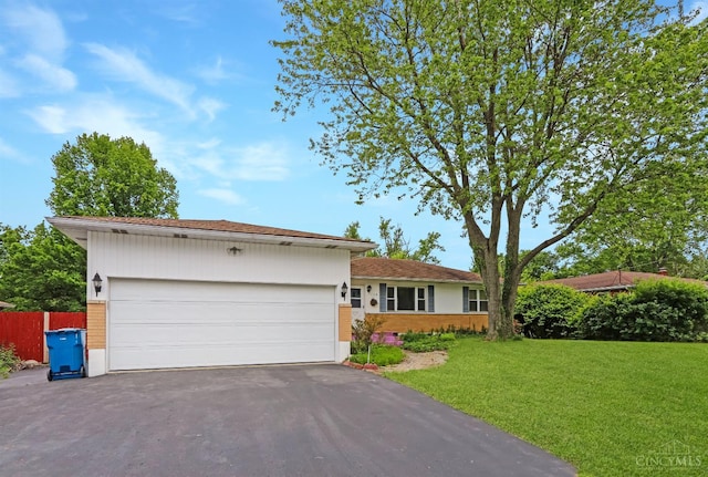738 Clough Pike, Union Twp, OH 45245 - ranch-style house featuring asphalt driveway, brick siding, and an attached garage