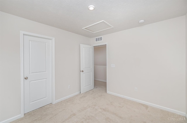 6482 Tralee Ln, Goshen Twp, OH 45122 - unfurnished bedroom with attic access, light carpet, and baseboards