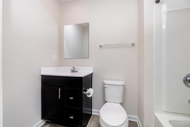6482 Tralee Ln, Goshen Twp, OH 45122 - full bath featuring vanity, baseboards, toilet, wood finished floors, and shower / washtub combination