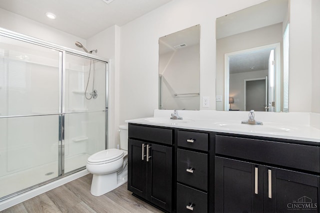 6482 Tralee Ln, Goshen Twp, OH 45122 - full bathroom with toilet, wood finished floors, a shower stall, and double vanity