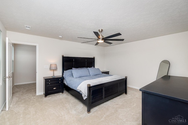 6482 Tralee Ln, Goshen Twp, OH 45122 - bedroom with light colored carpet, a ceiling fan, baseboards, and a textured ceiling
