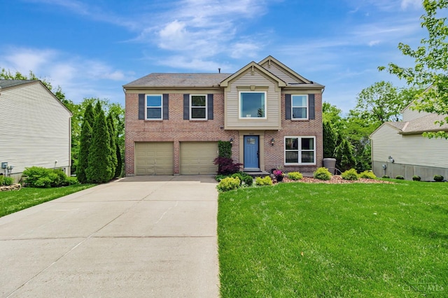 4600 Blainfield Ct, Union Twp, OH 45103 - view of front of home featuring concrete driveway, a garage, a front lawn, and brick siding