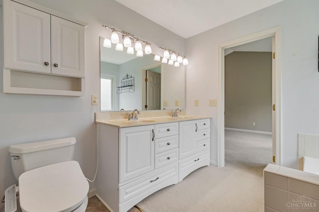 4600 Blainfield Ct, Union Twp, OH 45103 - full bathroom featuring double vanity, toilet, and baseboards