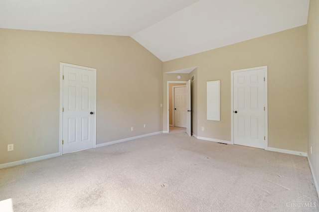 4600 Blainfield Ct, Union Twp, OH 45103 - unfurnished bedroom with lofted ceiling, light carpet, and baseboards