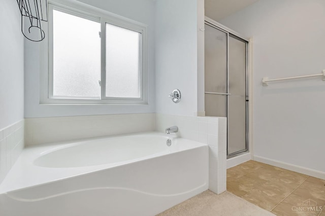 4600 Blainfield Ct, Union Twp, OH 45103 - full bath featuring a garden tub, a stall shower, baseboards, and tile patterned flooring