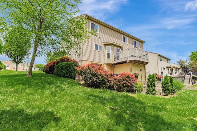 4600 Blainfield Ct, Union Twp, OH 45103 - back of property featuring a balcony and a lawn