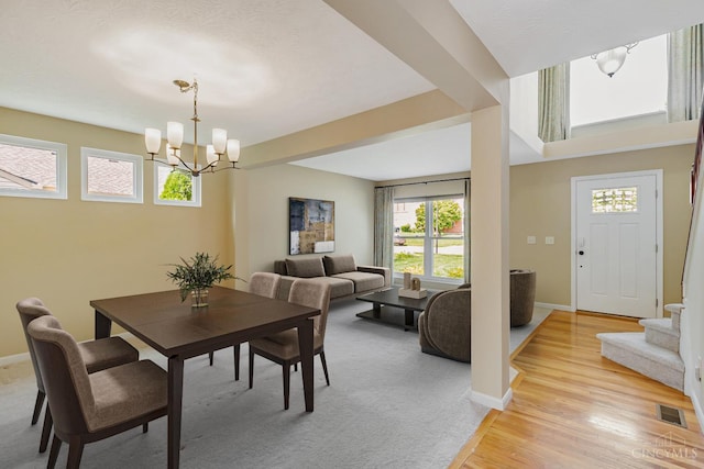 4600 Blainfield Ct, Union Twp, OH 45103 - dining room featuring a chandelier, baseboards, and light wood-style floors
