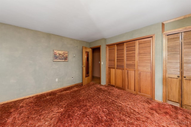 9488 Daugherty Marks Rd, Clark Twp, OH 45130 - unfurnished bedroom featuring two closets and carpet floors