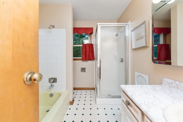 9488 Daugherty Marks Rd, Clark Twp, OH 45130 - full bathroom featuring an enclosed shower, vanity, a tub to relax in, and baseboards