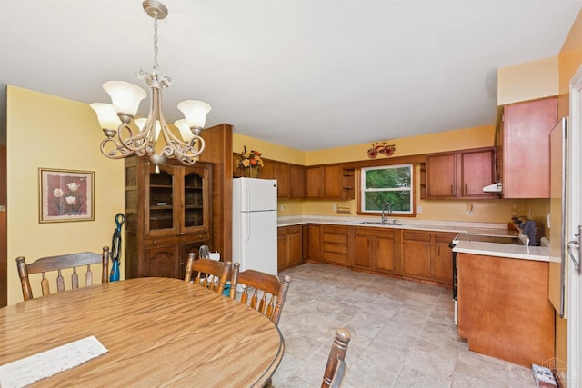 9488 Daugherty Marks Rd, Clark Twp, OH 45130 - kitchen featuring freestanding refrigerator, light countertops, a chandelier, and ventilation hood