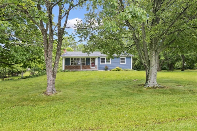 9488 Daugherty Marks Rd, Clark Twp, OH 45130 - ranch-style house featuring a chimney, a front yard, and covered porch