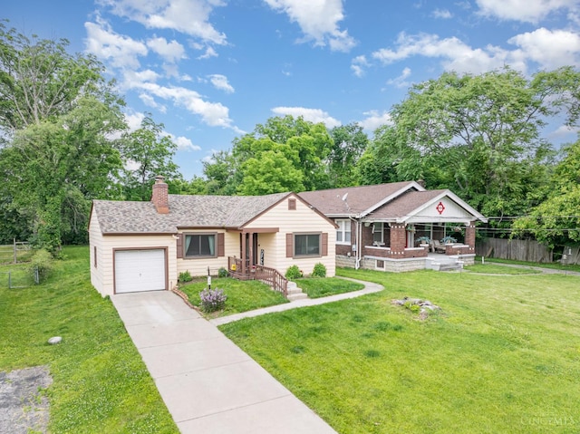 5411 Lester Rd, Cincinnati, OH 45213 - single story home with an attached garage, a chimney, concrete driveway, and roof with shingles