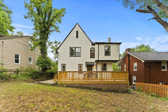 3970 Abington Ave, Cincinnati, OH 45229 - back of house featuring a wooden deck, stucco siding, and a chimney