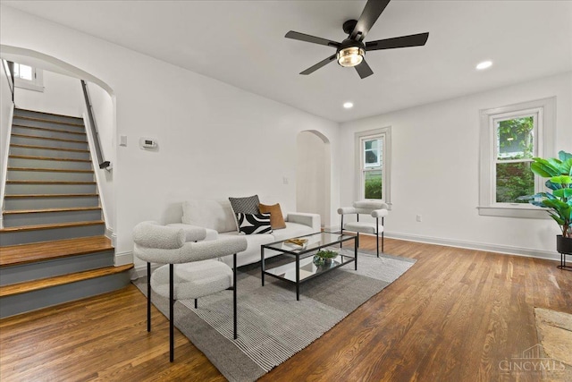 3970 Abington Ave, Cincinnati, OH 45229 - living room featuring arched walkways, a ceiling fan, stairs, plenty of natural light, and recessed lighting