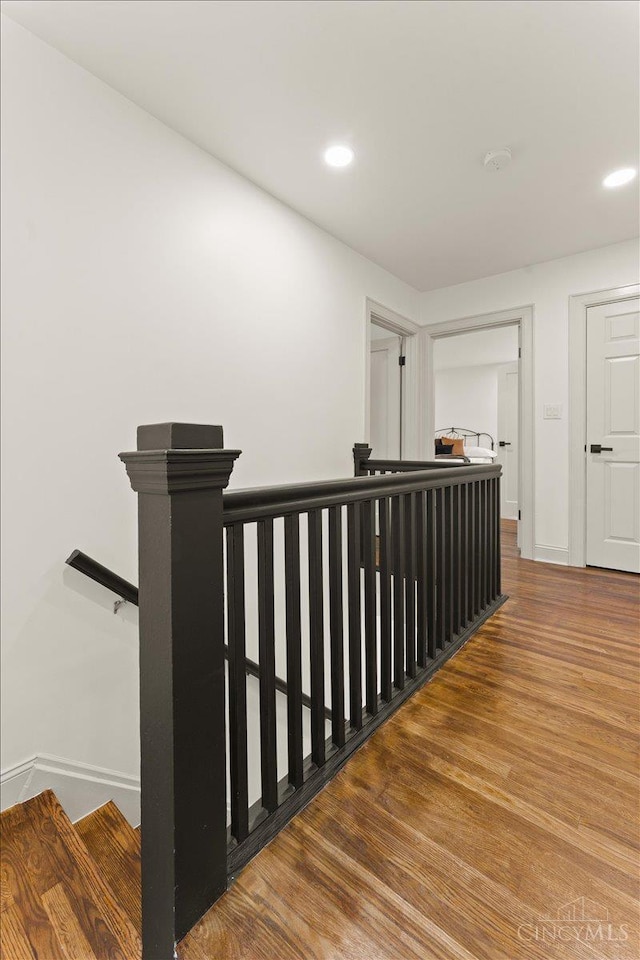 3970 Abington Ave, Cincinnati, OH 45229 - corridor with an upstairs landing, wood finished floors, and recessed lighting