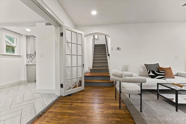3970 Abington Ave, Cincinnati, OH 45229 - living area featuring arched walkways, stairs, recessed lighting, and wood finished floors