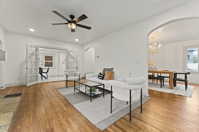 3970 Abington Ave, Cincinnati, OH 45229 - living area with arched walkways, ceiling fan, wood finished floors, recessed lighting, and a chandelier
