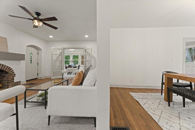 3970 Abington Ave, Cincinnati, OH 45229 - living area featuring wood finished floors, a ceiling fan, recessed lighting, and arched walkways