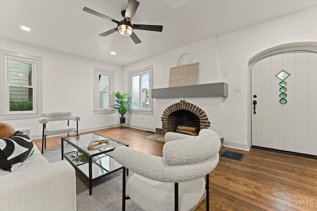 3970 Abington Ave, Cincinnati, OH 45229 - living area featuring dark wood-type flooring, a brick fireplace, ceiling fan, and recessed lighting