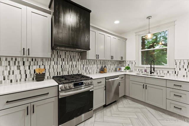 3970 Abington Ave, Cincinnati, OH 45229 - kitchen featuring appliances with stainless steel finishes, gray cabinetry, tasteful backsplash, light countertops, and recessed lighting