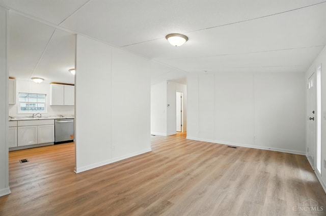 665 Diamond Loop, Middletown, OH 45044 - spare room featuring light wood-style flooring, a sink, and baseboards